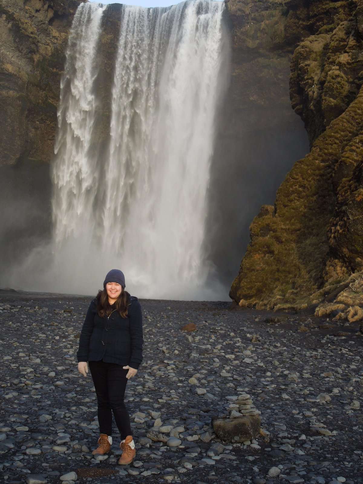 The Last of Iceland's South Coast 3 Riana standing in front of Skogafoss waterfall