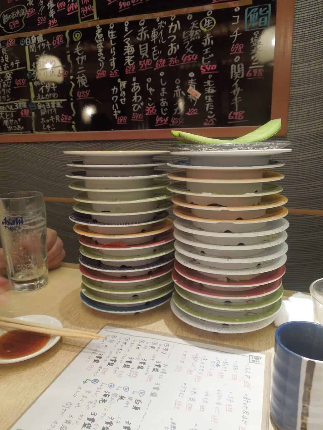 Adventures Around Tokyo with the Kosekis 12 Empty plates showing how much sushi we ate in Tokyo Japan