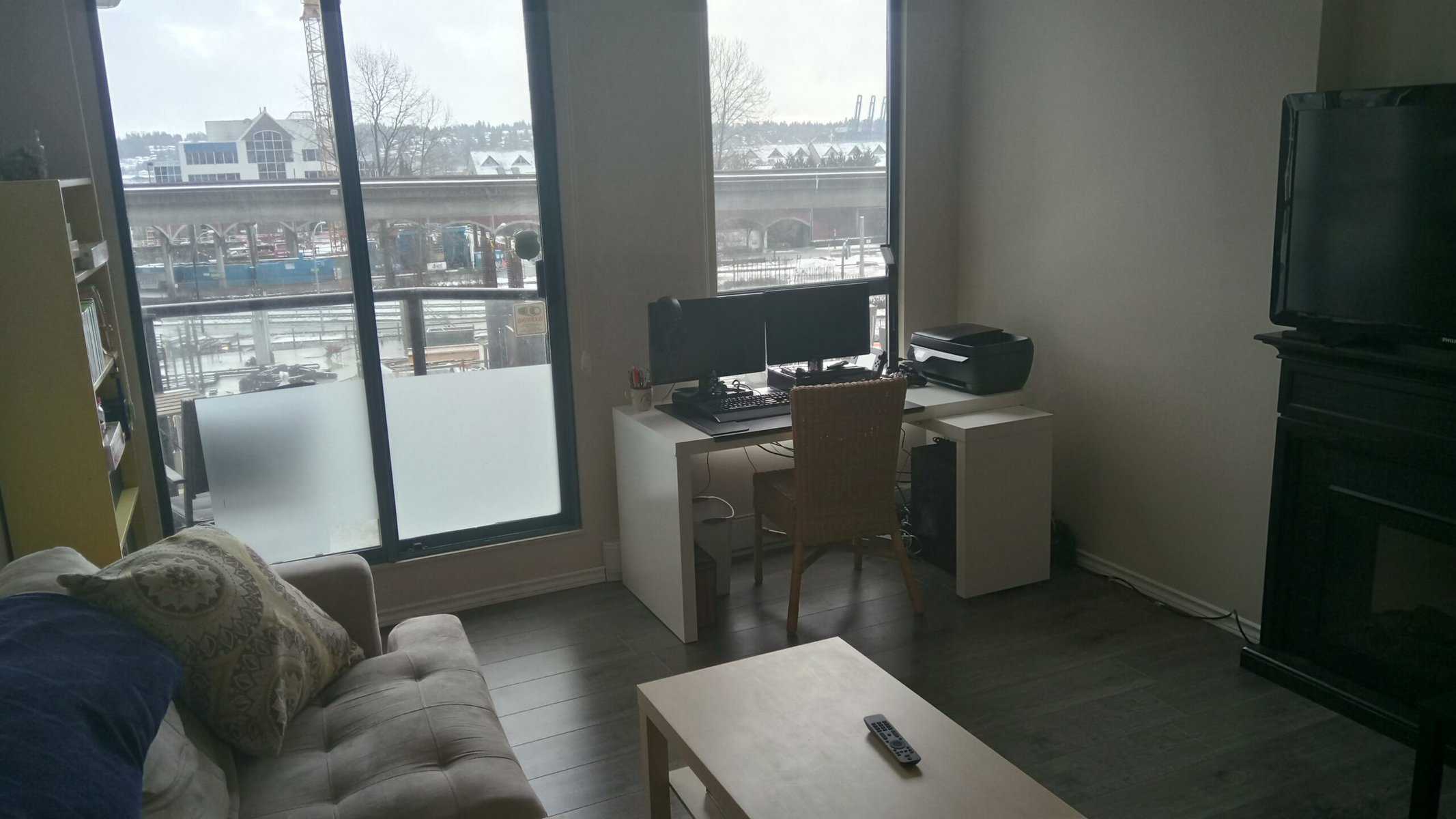 Welcome to Our Home in New Westminster, BC 2 Colin's desk and our stunning view of a construction site in our new apartment in New West