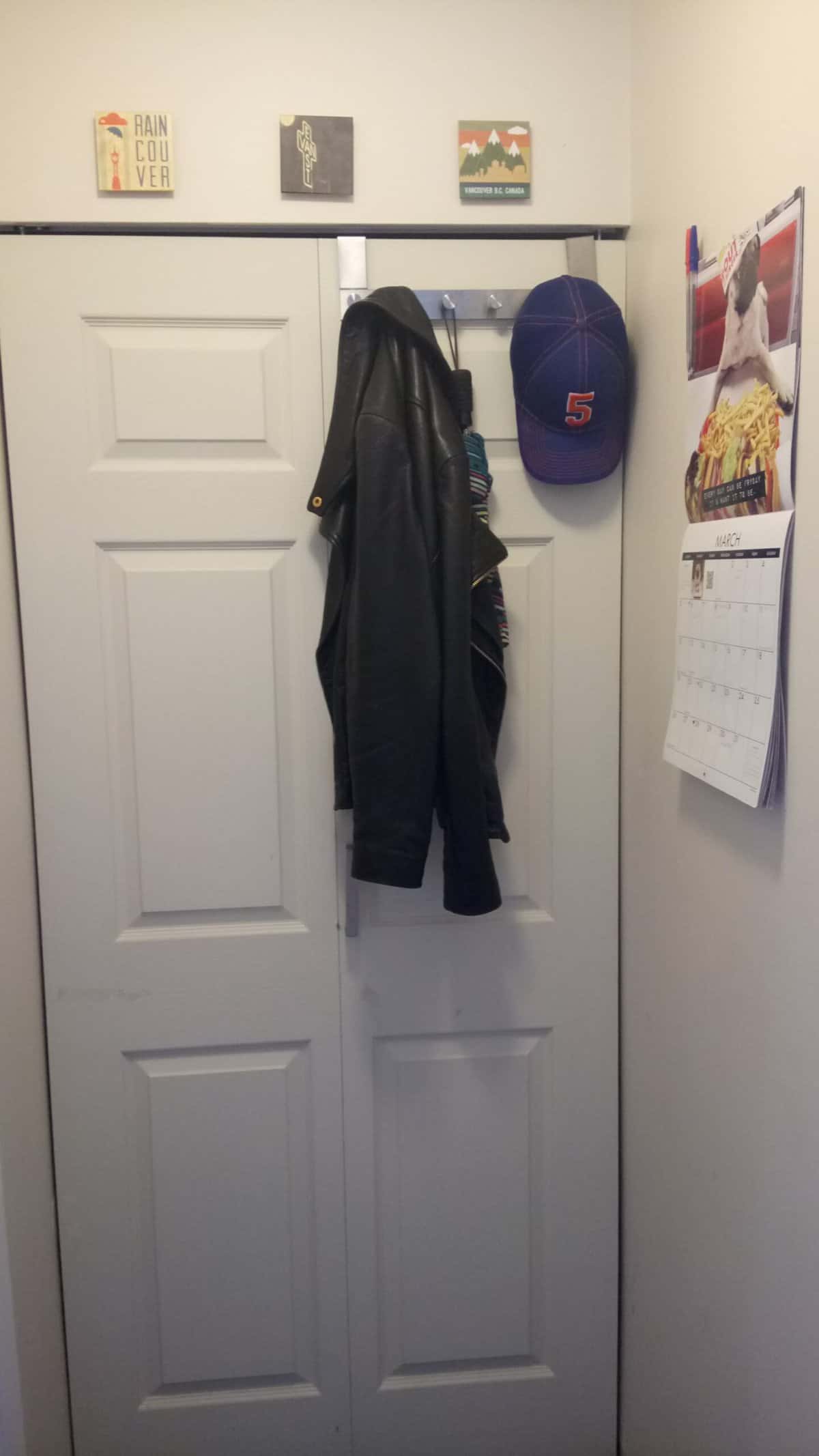 Welcome to Our Home in New Westminster, BC 8 Hallway closet with hanging jacket, calendar and decor