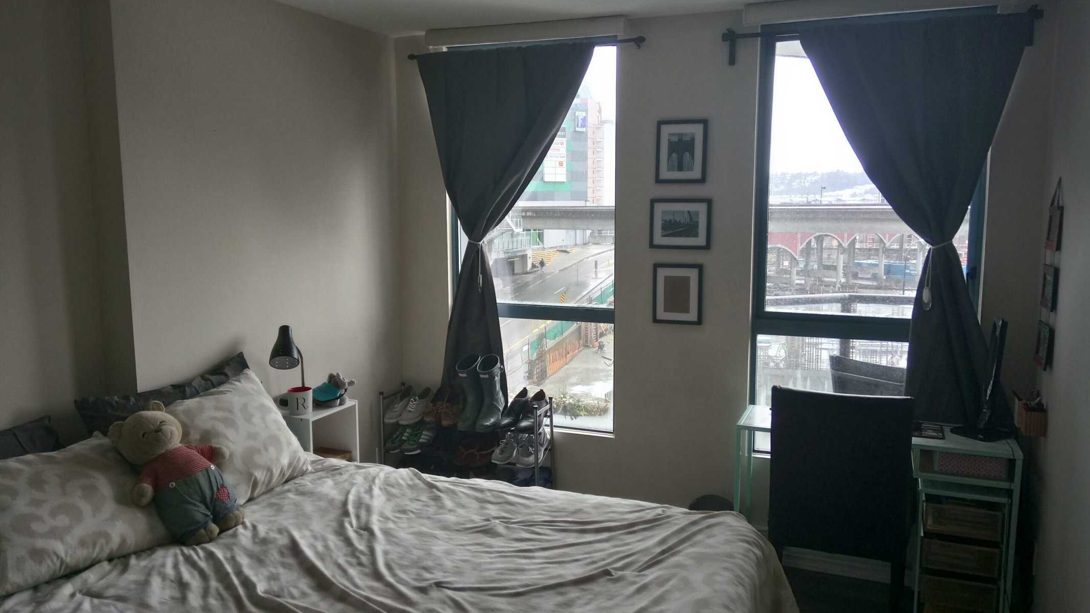 Welcome to Our Home in New Westminster, BC 9 Bedroom with bed, stuffed animal, desk and curtains