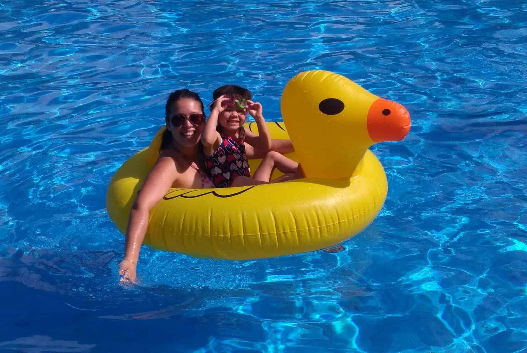 A Family-Filled December 5 My sister and cousin sitting in a duck floatie in the pool
