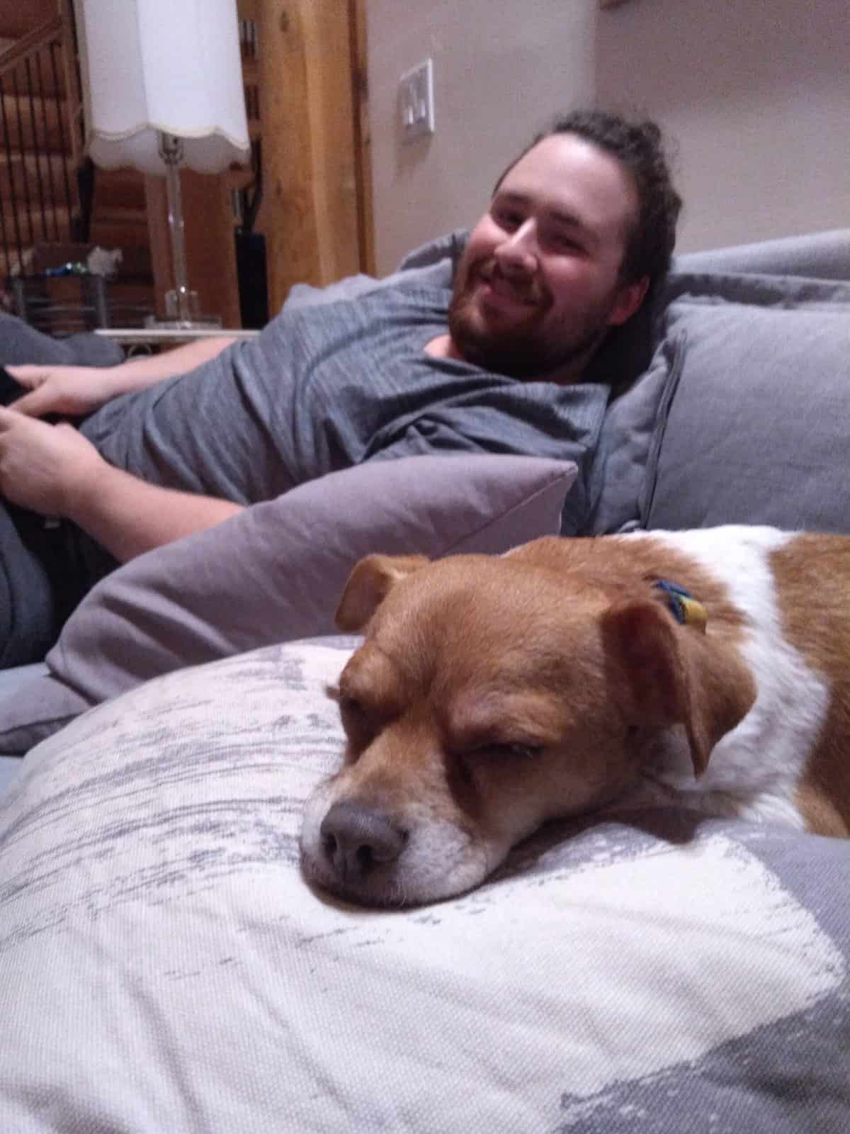 The Best Log Cabin Weekend in Hope, BC 7 Colin relaxing on the couch with our dog, Ellie