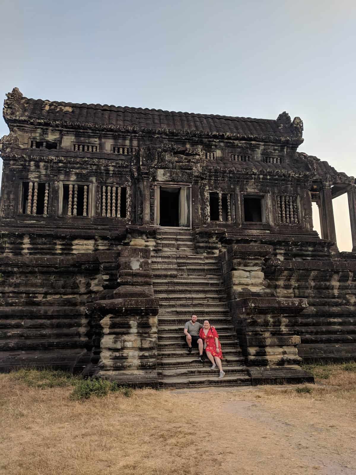 The Best and Worst of Southeast Asia 11 Riana and Colin sitting on the steps of a temple in Angkor Wat, Cambodia