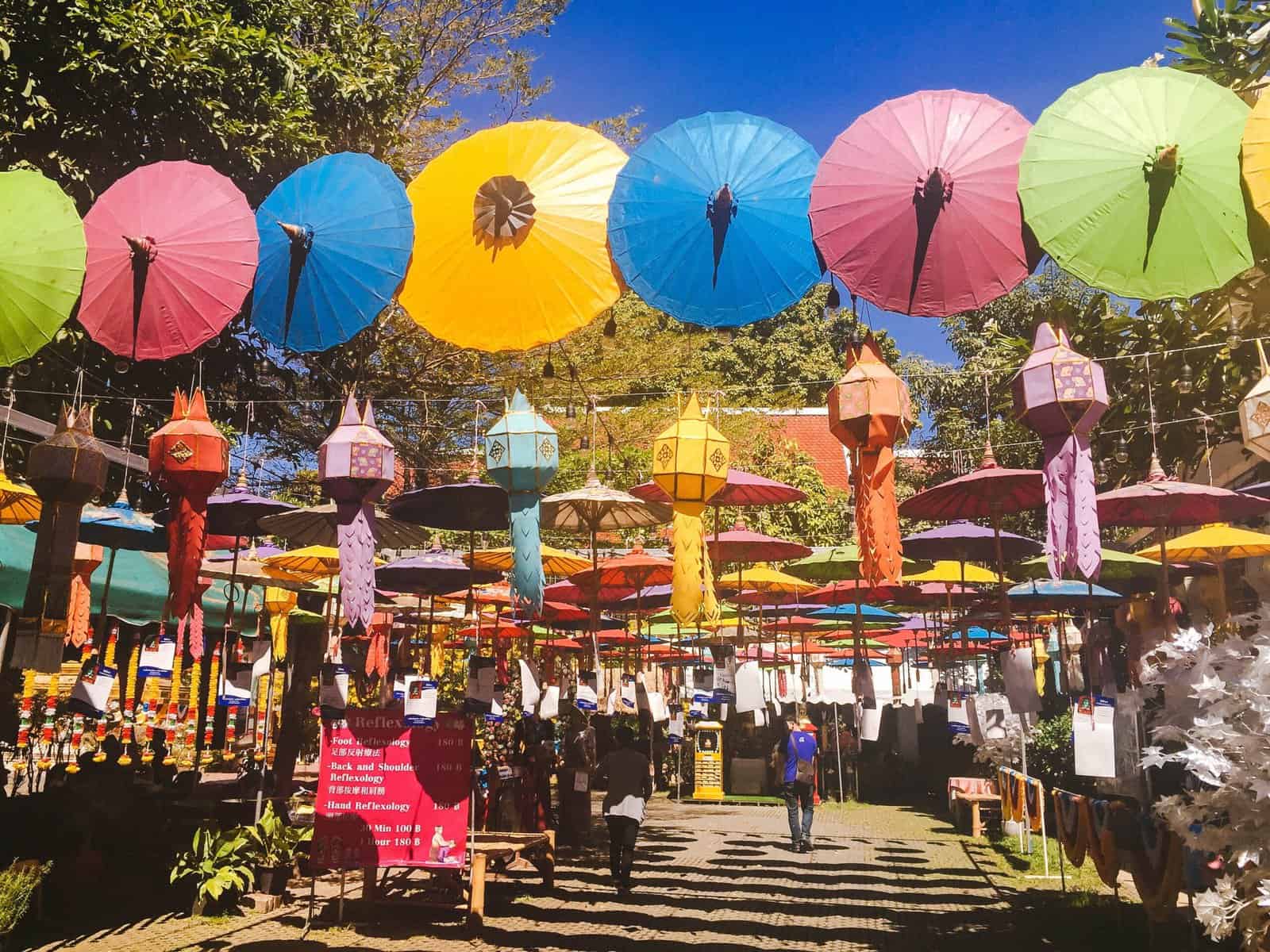 temple square in Chiang Mai, Thailand with colourful lanterns and umbrellas 