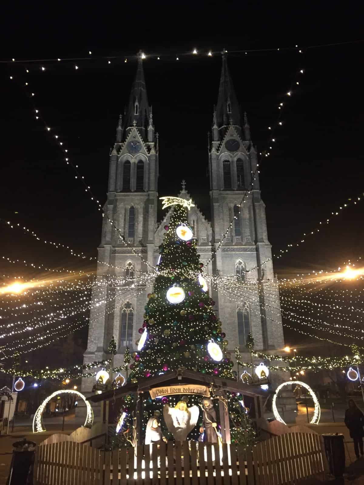 8 Things I Miss About Living in Prague 20 A large Christmas tree and nativity scene set up in front of a church at the Namesti Miru Christmas Market
