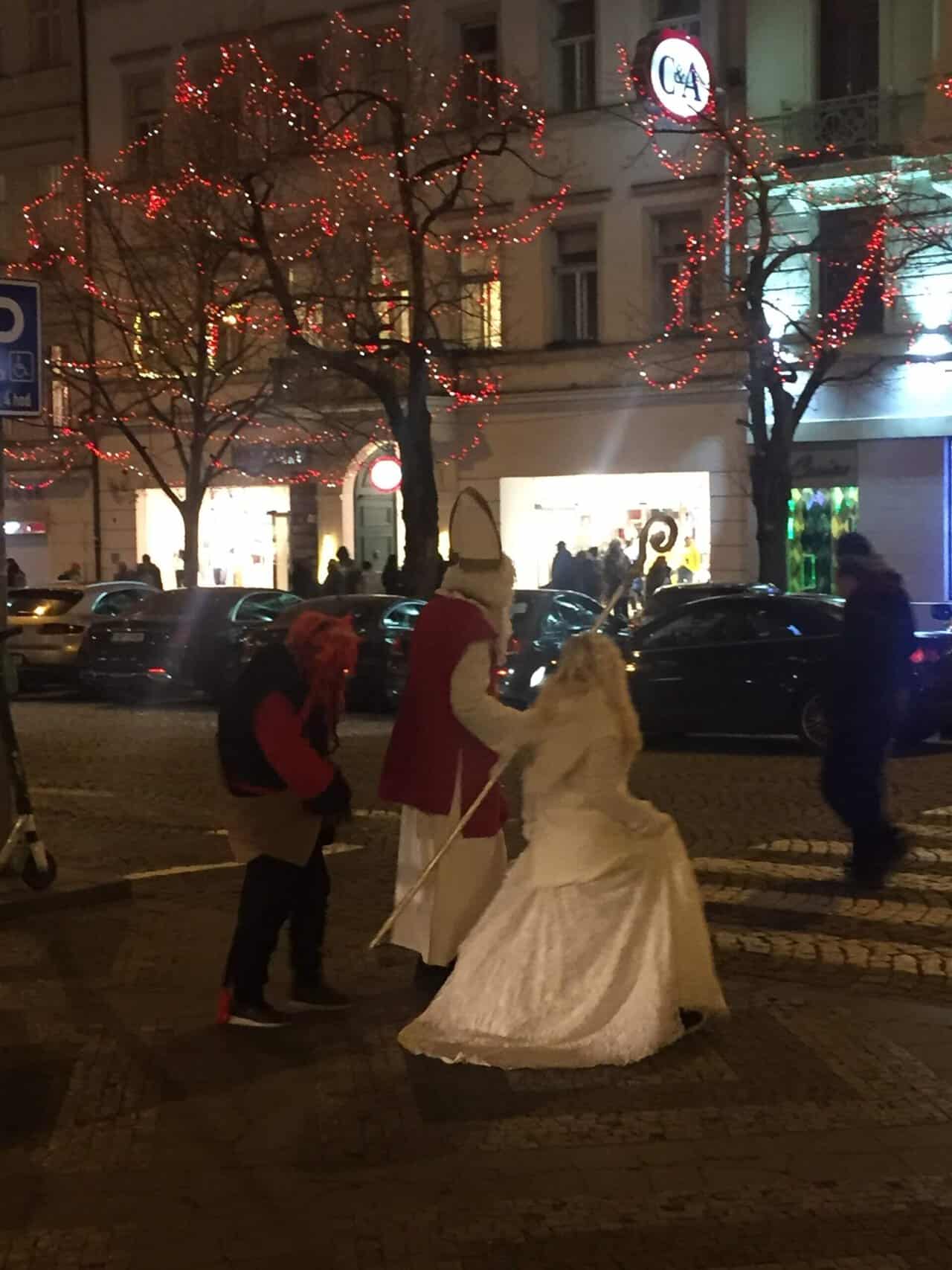 The Ultimate European Christmas Market Road Trip 8 Fuzzy photo of St Nick, the angel and the devil wandering the streets on St Nicholas Day in Prague 2019