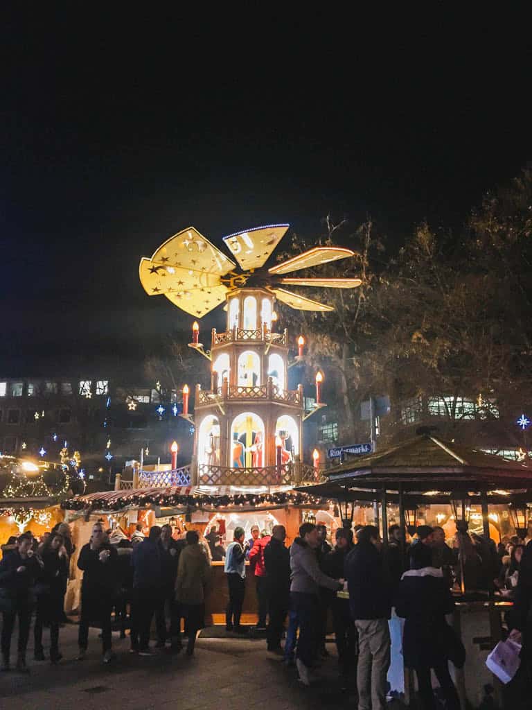The Ultimate European Christmas Market Road Trip 39 Large stand Christmas decor at the Munich Christmas Markets with people standing around it