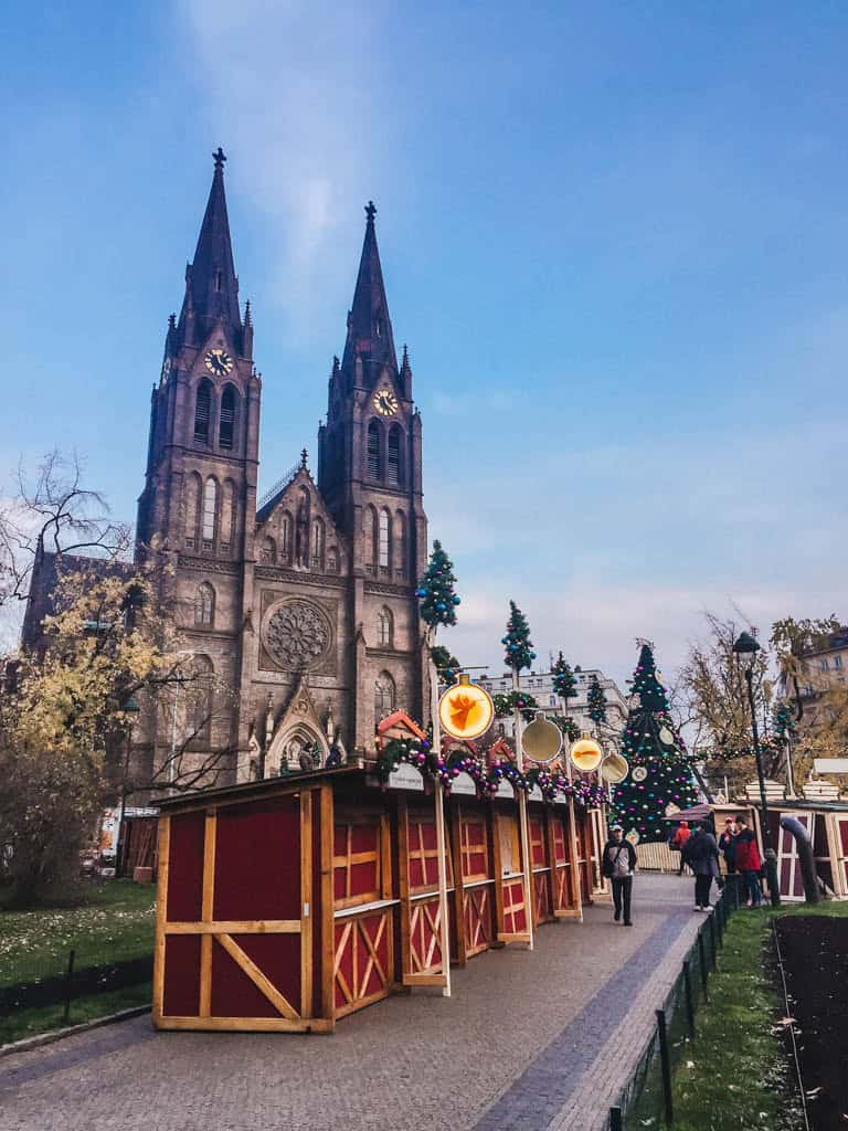 The Ultimate European Christmas Market Road Trip 5 Stalls setting up outside the church at the Namesti Miru Christmas Market in Prague