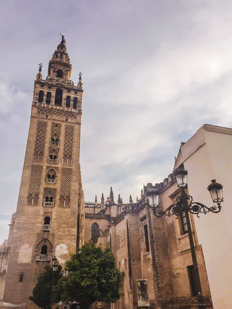 Falling in Love with Seville 6 The exterior of the Seville Cathedral and Giralda Tower