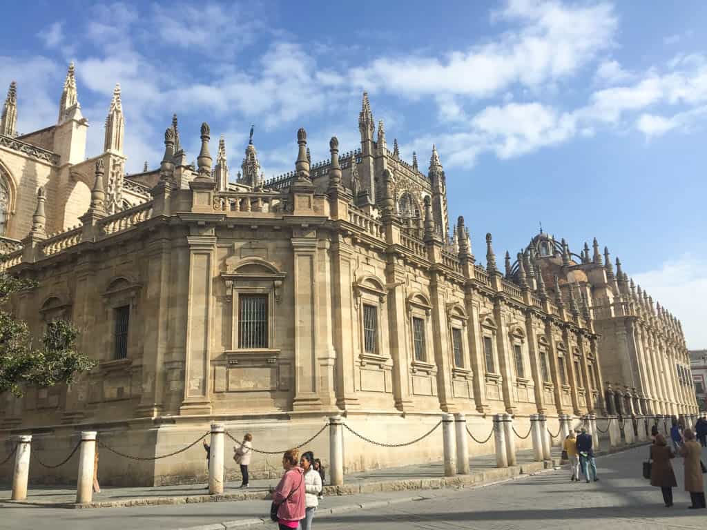 Falling in Love with Seville 15 Exterior of the Seville Cathedral with many ornate columns
