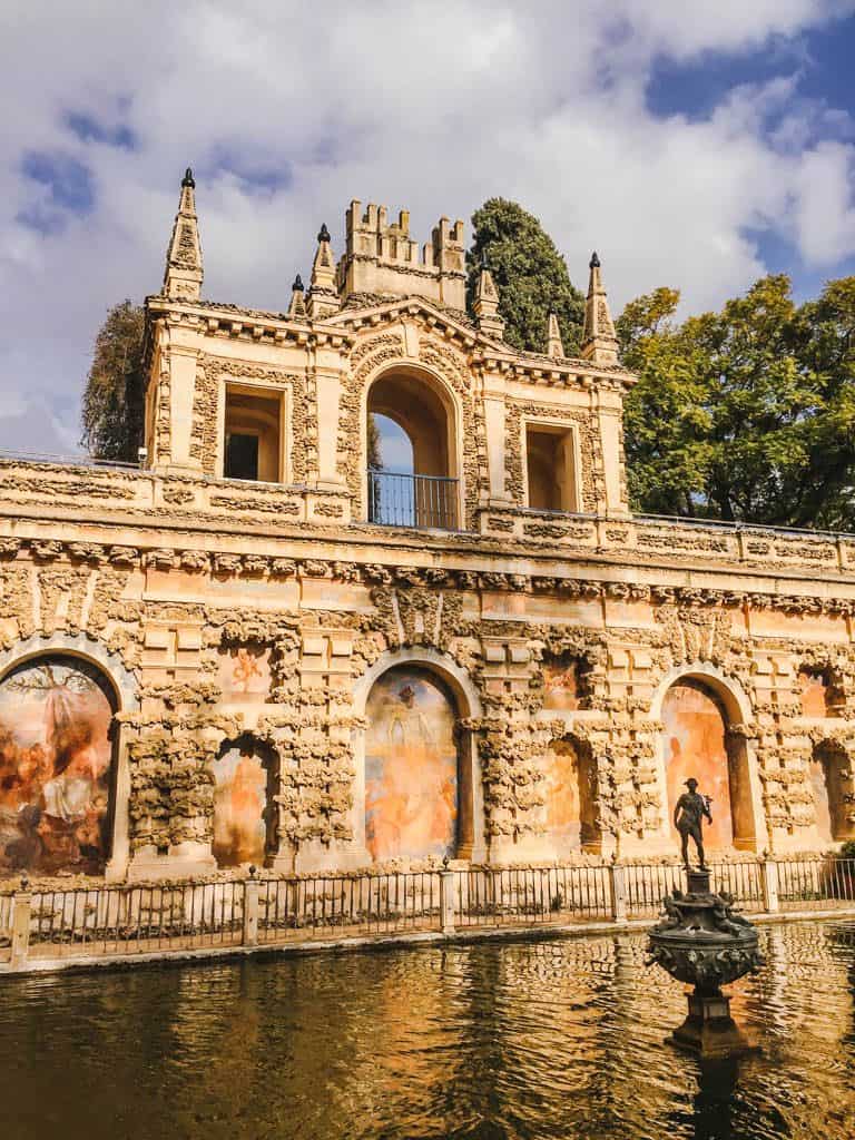 Falling in Love with Seville 23 Ornate wall and fountain at the Royal Alcazar of Seville