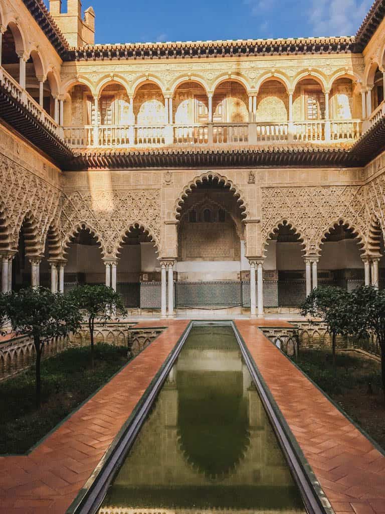 Falling in Love with Seville 27 Arches and a pond at the Royal Alcazar of Seville
