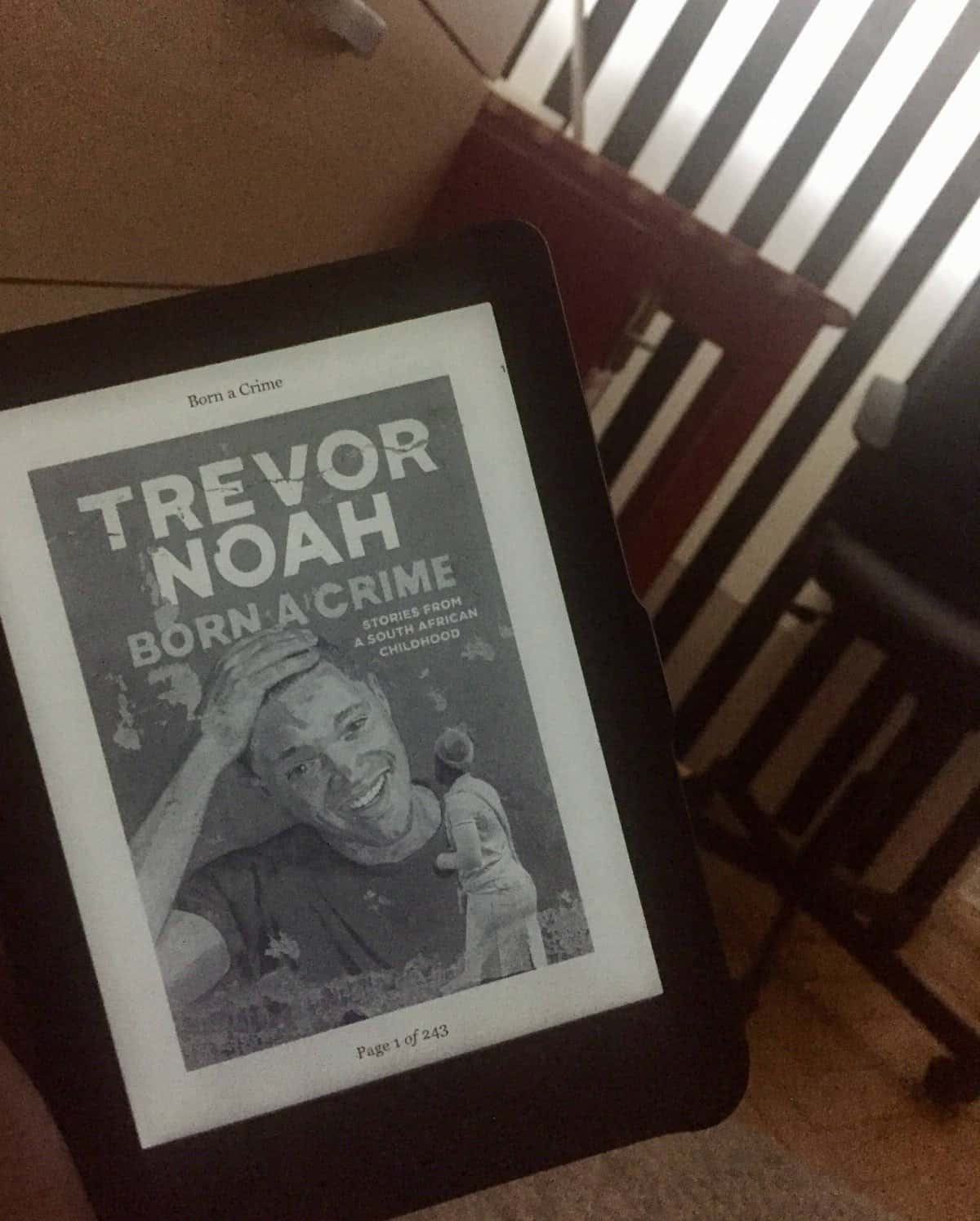 40+ Beach Reads for Every Reading Mood 5 Riana holding the ebook of Born a Crime by Trevor Noah