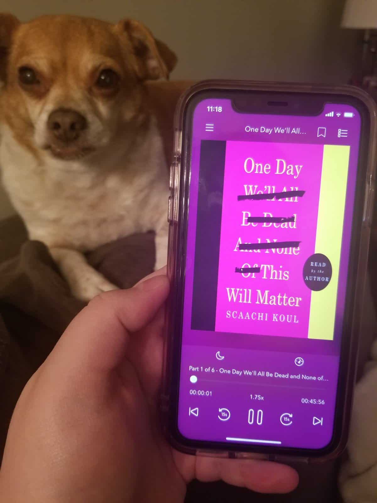 40+ Beach Reads for Every Reading Mood 24 Audiobook of One Day We'll All Be Dead and None of This Will Matter by Scaachi Koul with my dog Ellie in the background