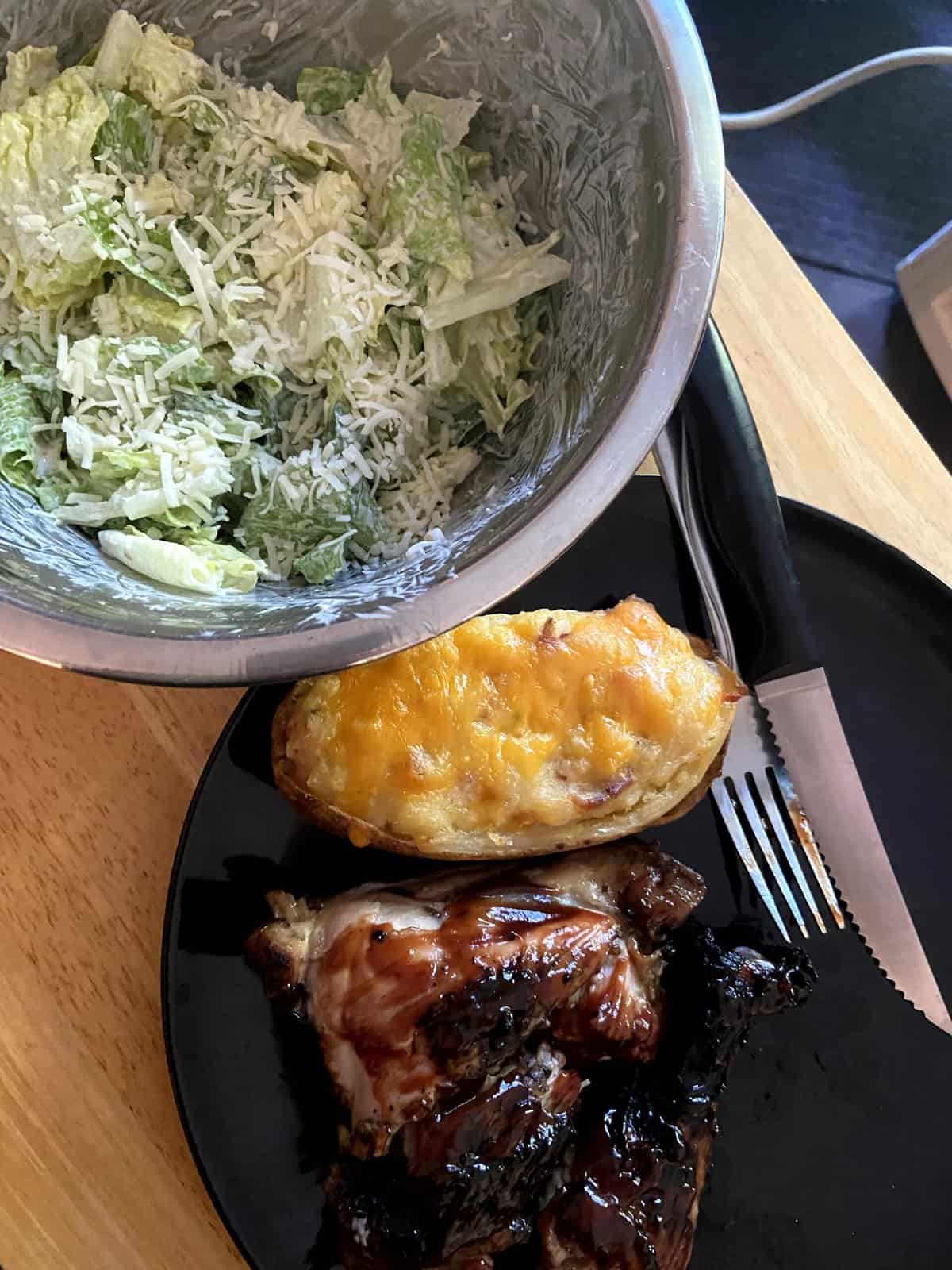 Colin's delicious dinner of salad, baked potato and bbq chicken