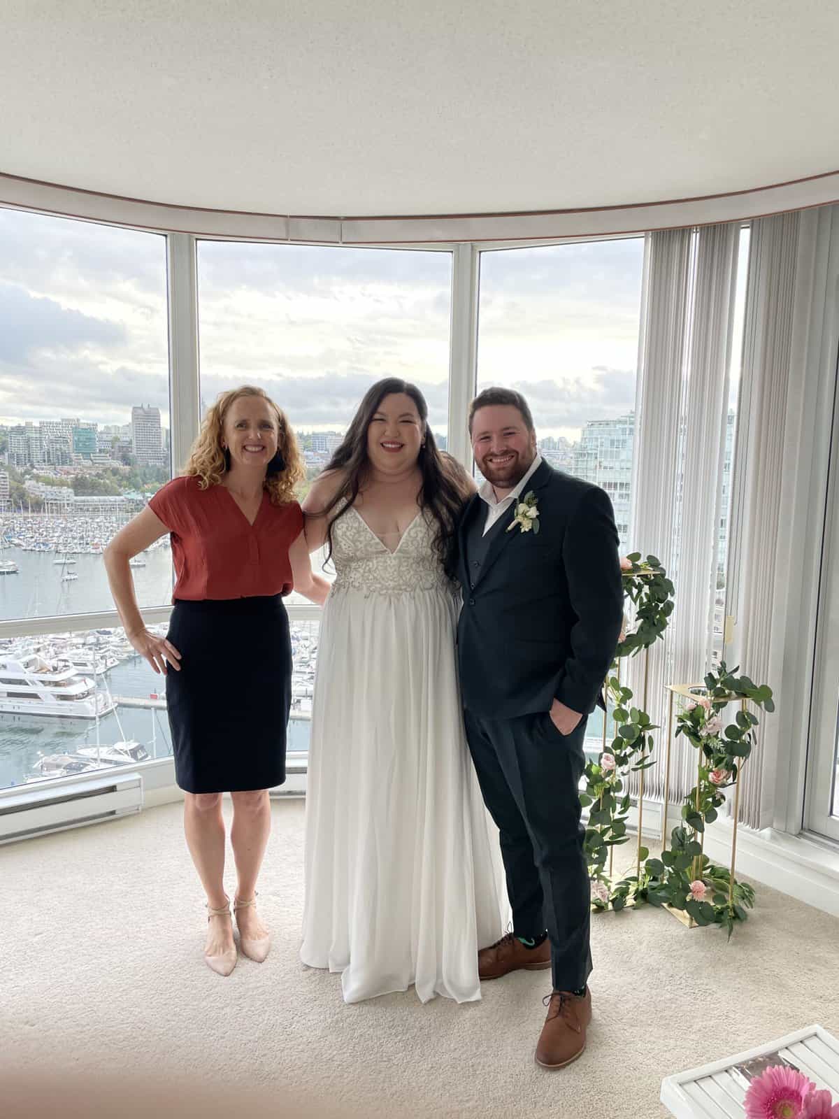 our wedding; photo with officiant Jane