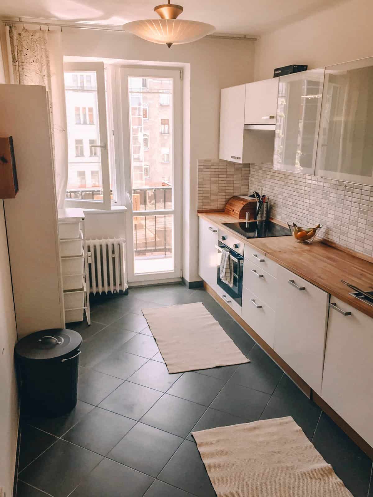 8 Things I Miss About Living in Prague 17 The kitchen in our apartment in Prague with butcher block countertops and white cabinets