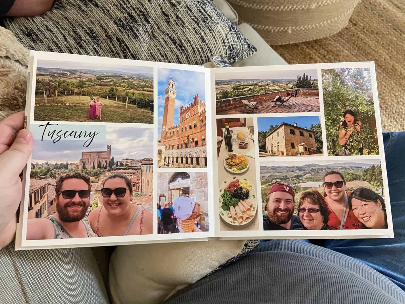 Holding open my Mixbook photo book with photos of Tuscany 
