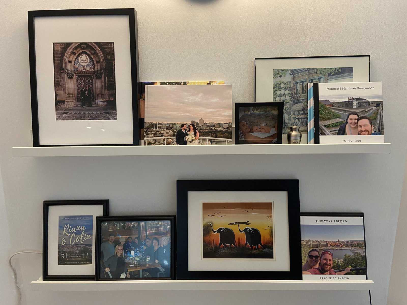 Photo books on display, gallery wall