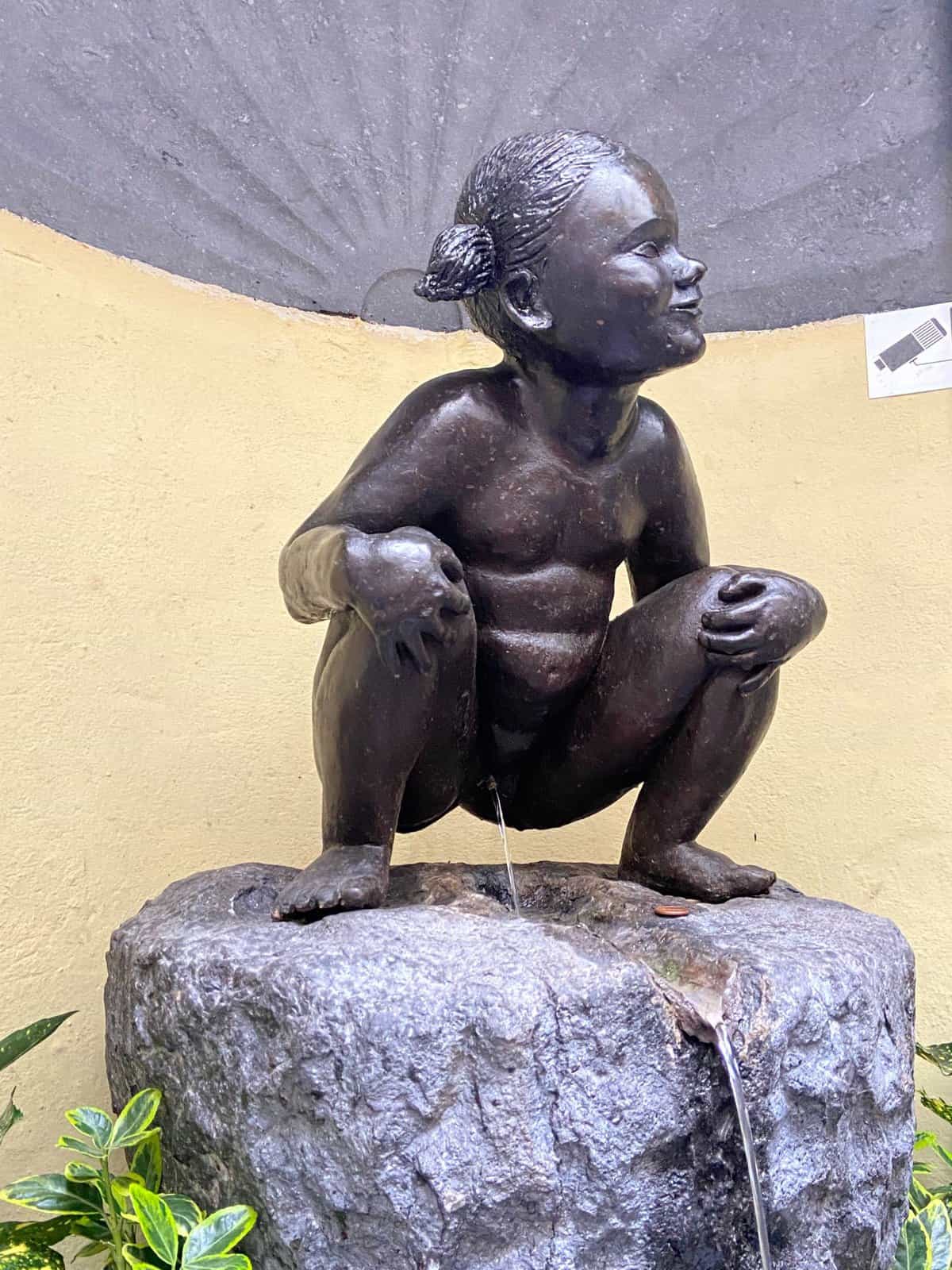 The 16 Best Rainy Day Activities in Brussels, Belgium 24 Jeanneke Pis statue on a brussels day trip