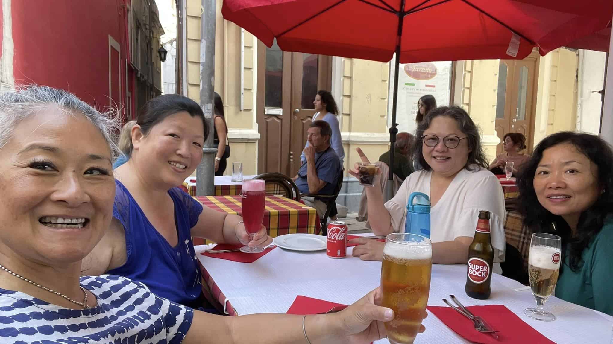 An 8 Week Spain and Portugal Itinerary With My Mom! 2 having beers in Coimbra, Portugal, first stop on the Spain and Portugal itinerary