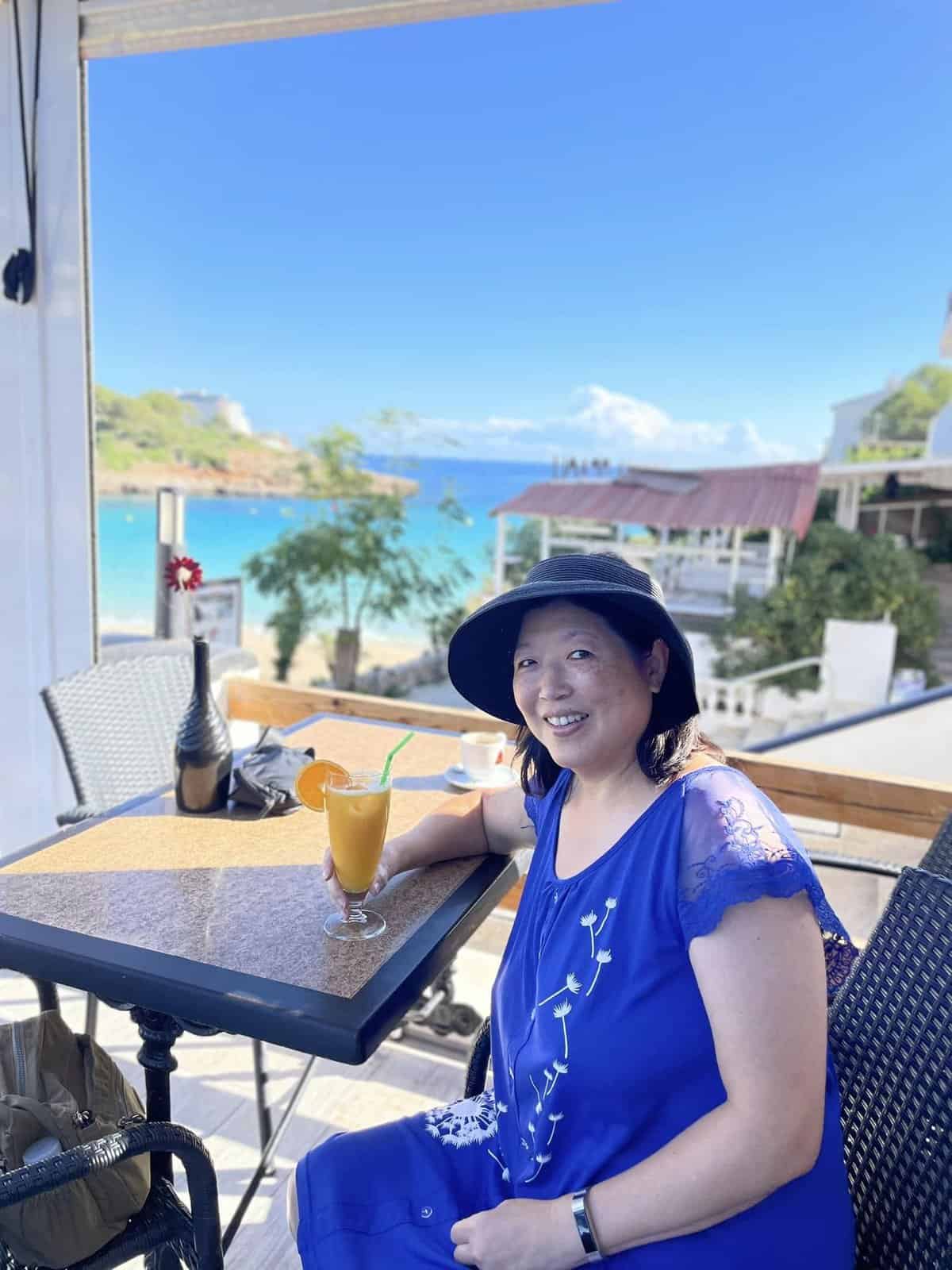 An 8 Week Spain and Portugal Itinerary With My Mom! 5 enjoying a juice and the view in Mallorca, Spain