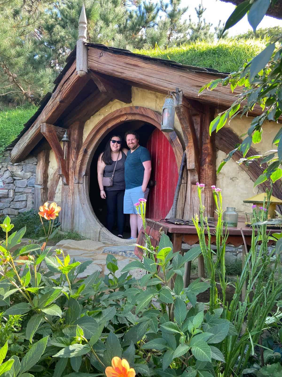 Riana and Colin in a Hobbit Hole at Hobbiton, New Zealand