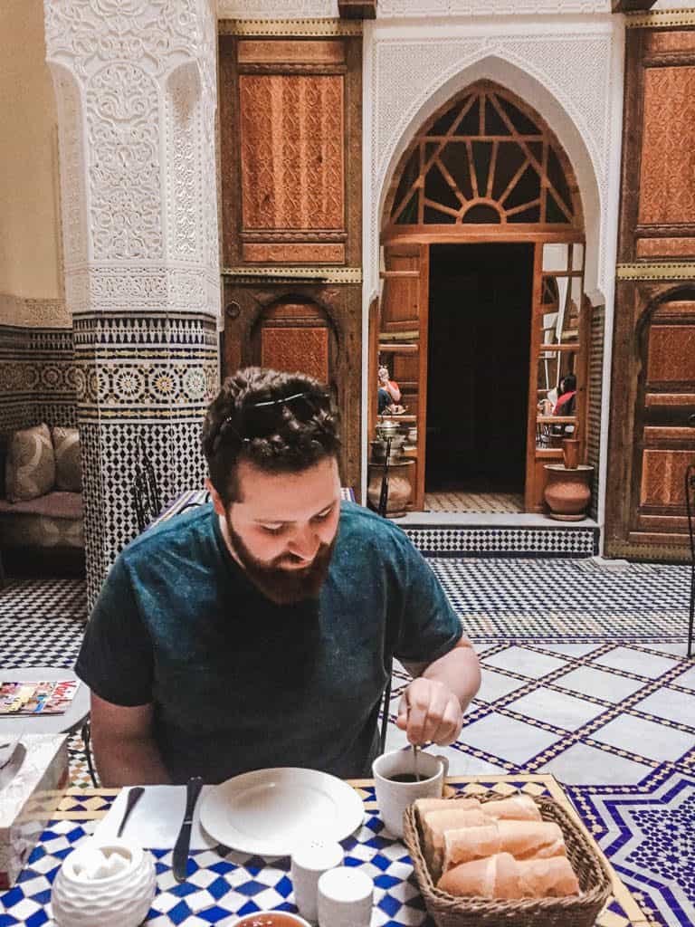 Colin eating breakfast at Riad Taryana in Fes, Morocco
