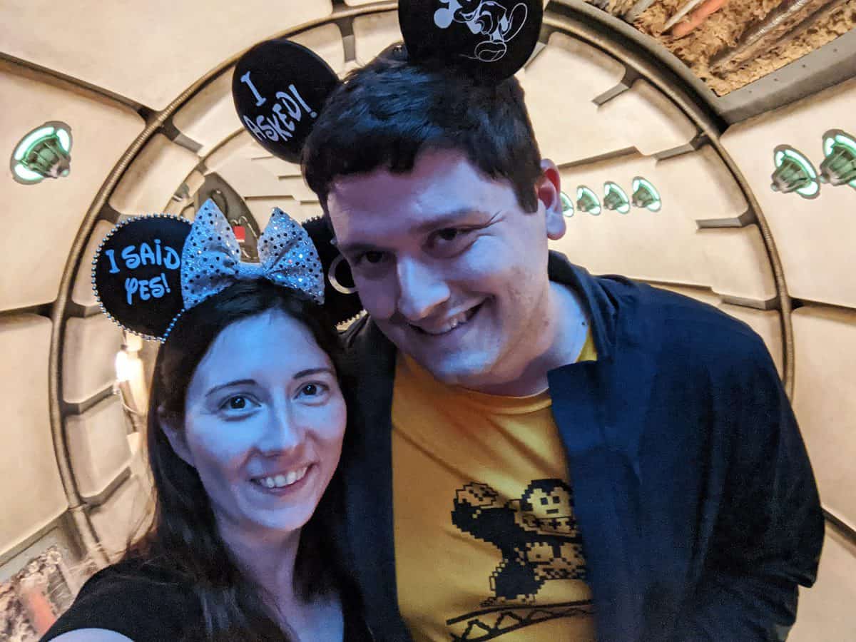 Kris and her husband at Millennium Falcon Smuggler's Run wearing Mickey ears
