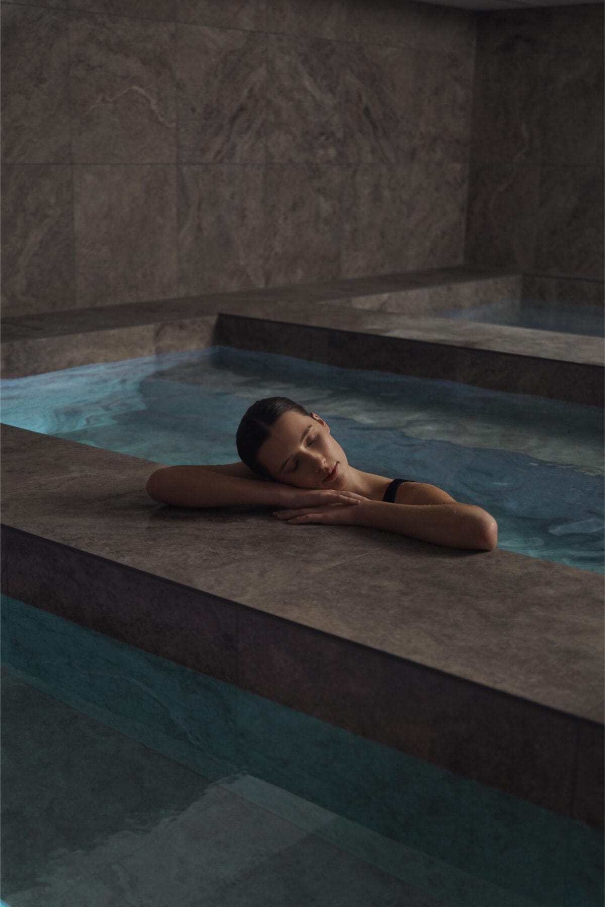 What to Do in Queenstown (If You're Not an Adrenaline Junkie) 10 A woman relaxing in the pools at the Bathhouse Spa Queenstown