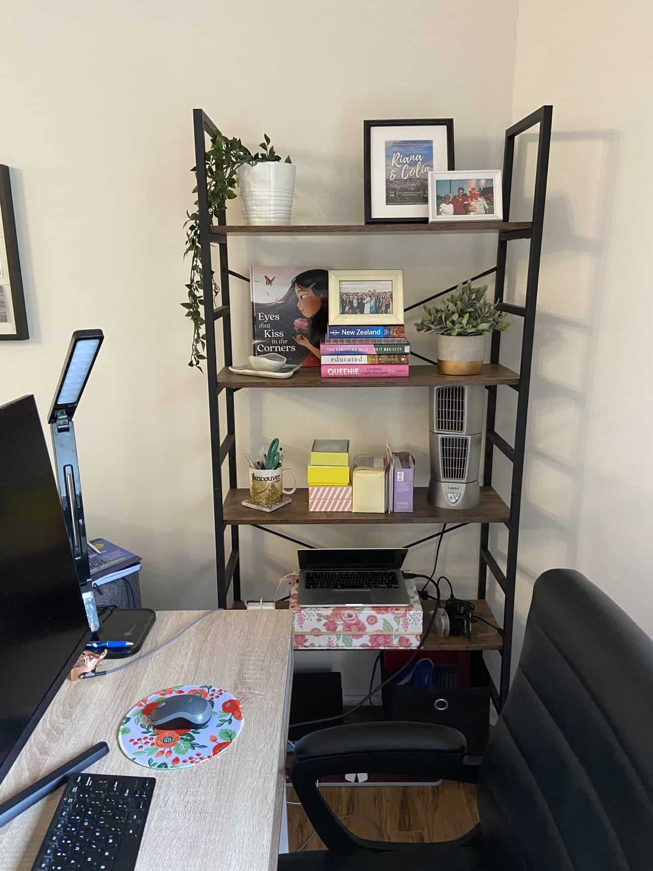 18 Freelancer Tips for Beginners (From an 8 Year Veteran!) 2 Riana's office with her desk, screen and chair on one side and a large shelf filled with decor and books on the other side