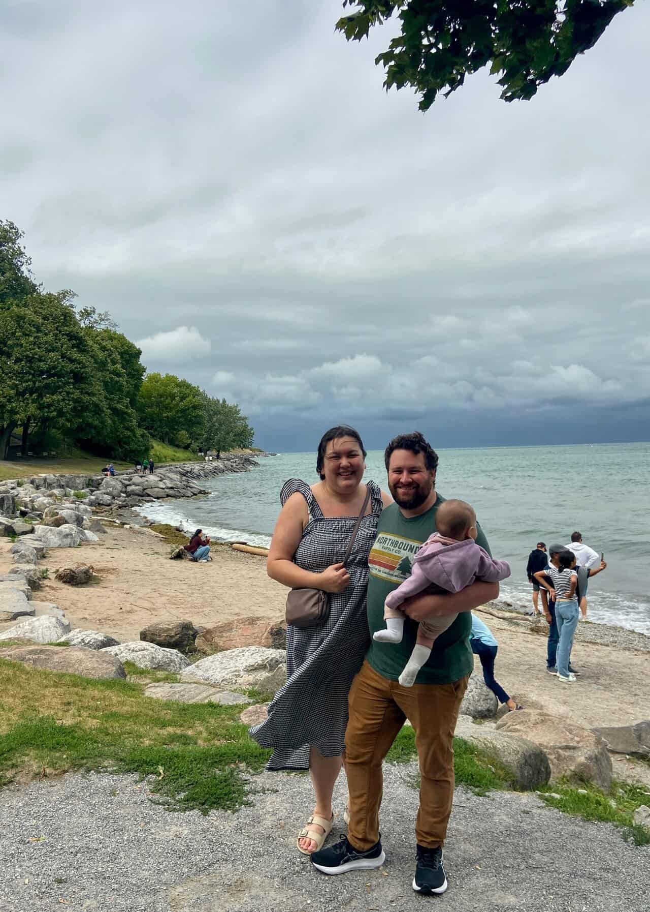 Riana, Colin and Baby C on a beach in Niagara on the Lake