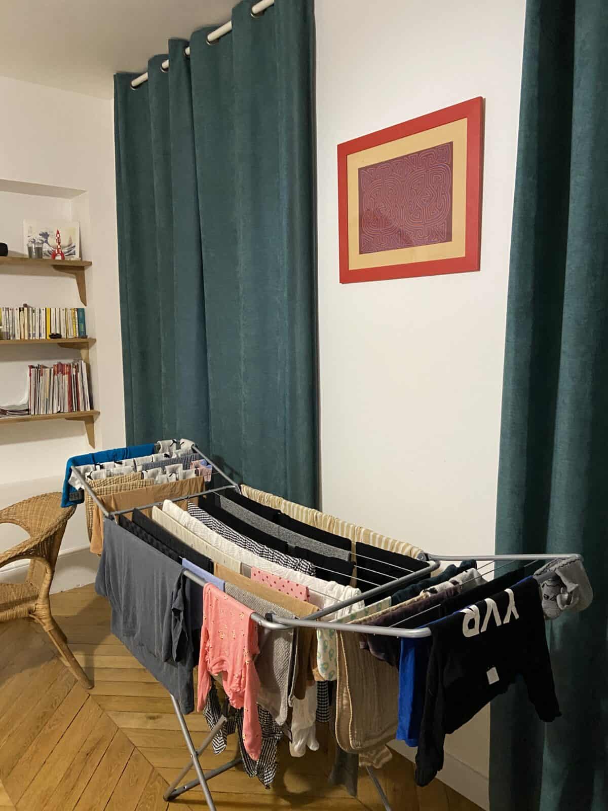 Our Essential Packing List for Travel with a Baby 23 Hanging laundry to dry on a drying rack in our Orleans apartment