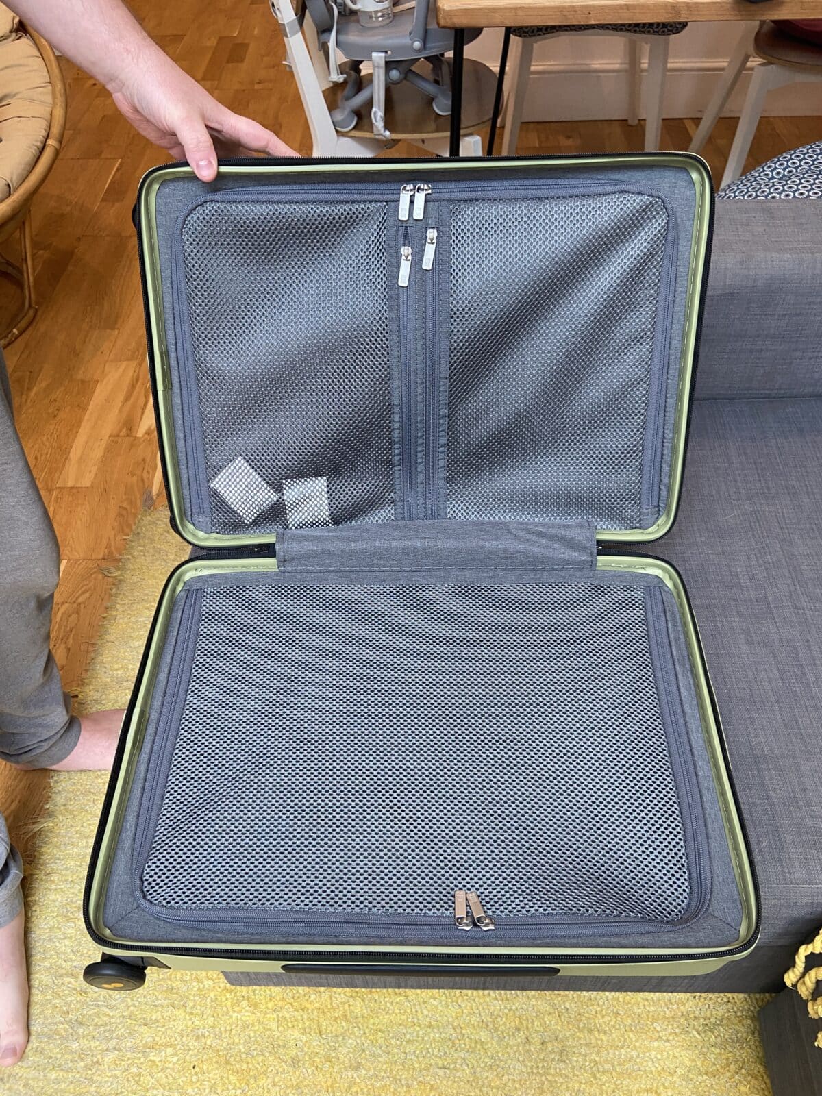 Our Essential Packing List for Travel with a Baby 5 Inside pockets of the LEVEL8 Luminous Textured 20" carry-on bag in olive green