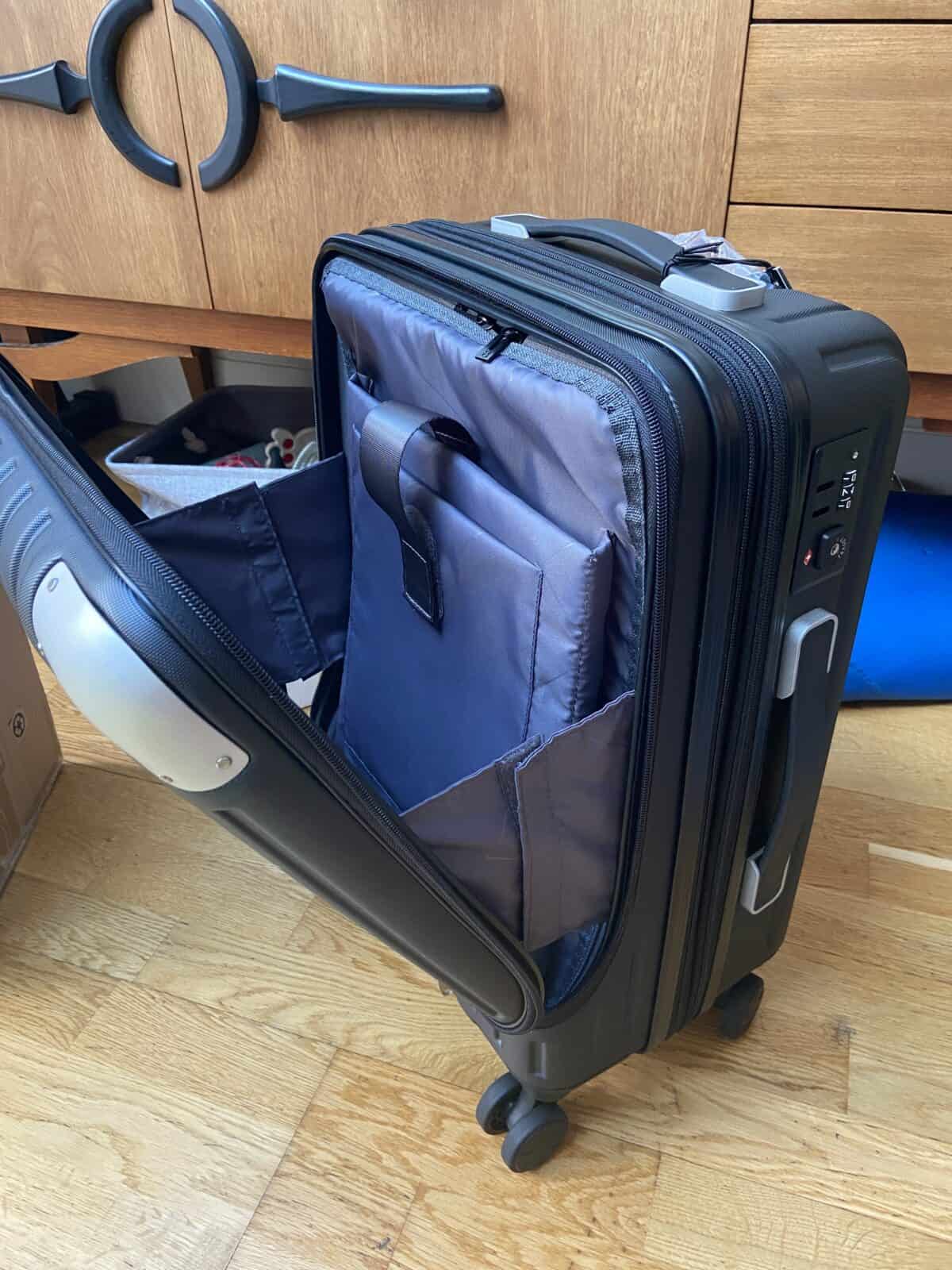 Our Essential Packing List for Travel with a Baby 7 LEVEL8 Grace Hardside Carry-On suitcase with the laptop pocket open