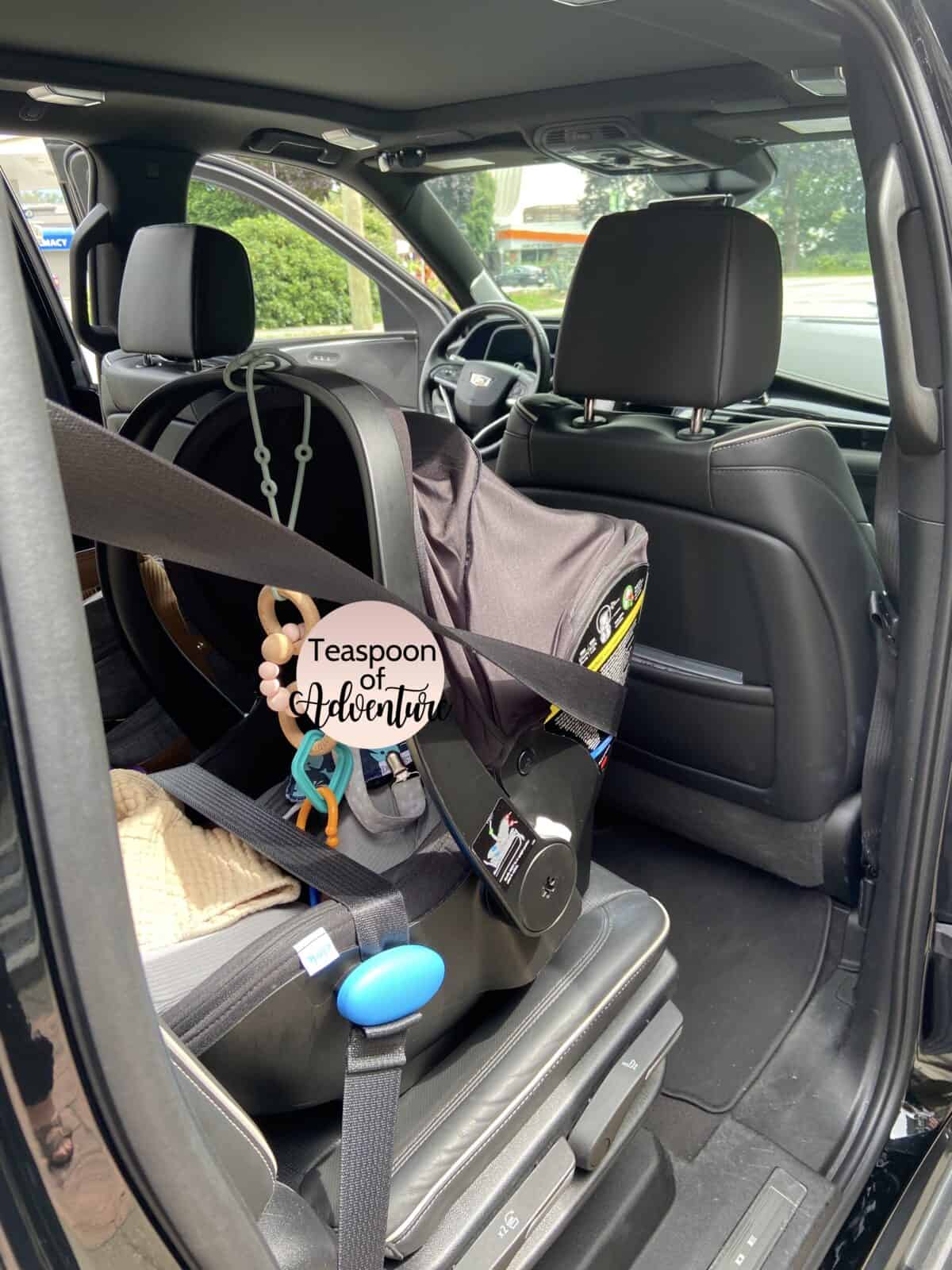 Our Essential Packing List for Travel with a Baby 17 Clek Liingo car seat strapped into a black car