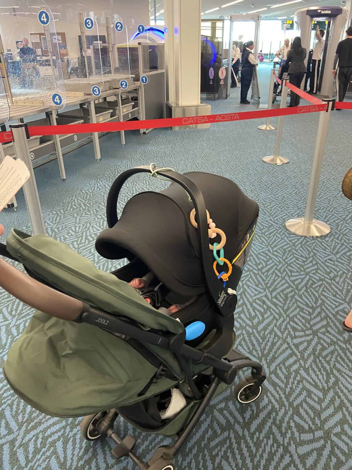 Our Essential Packing List for Travel with a Baby 13 Wheeling our travel stroller with a car seat attached through airport security