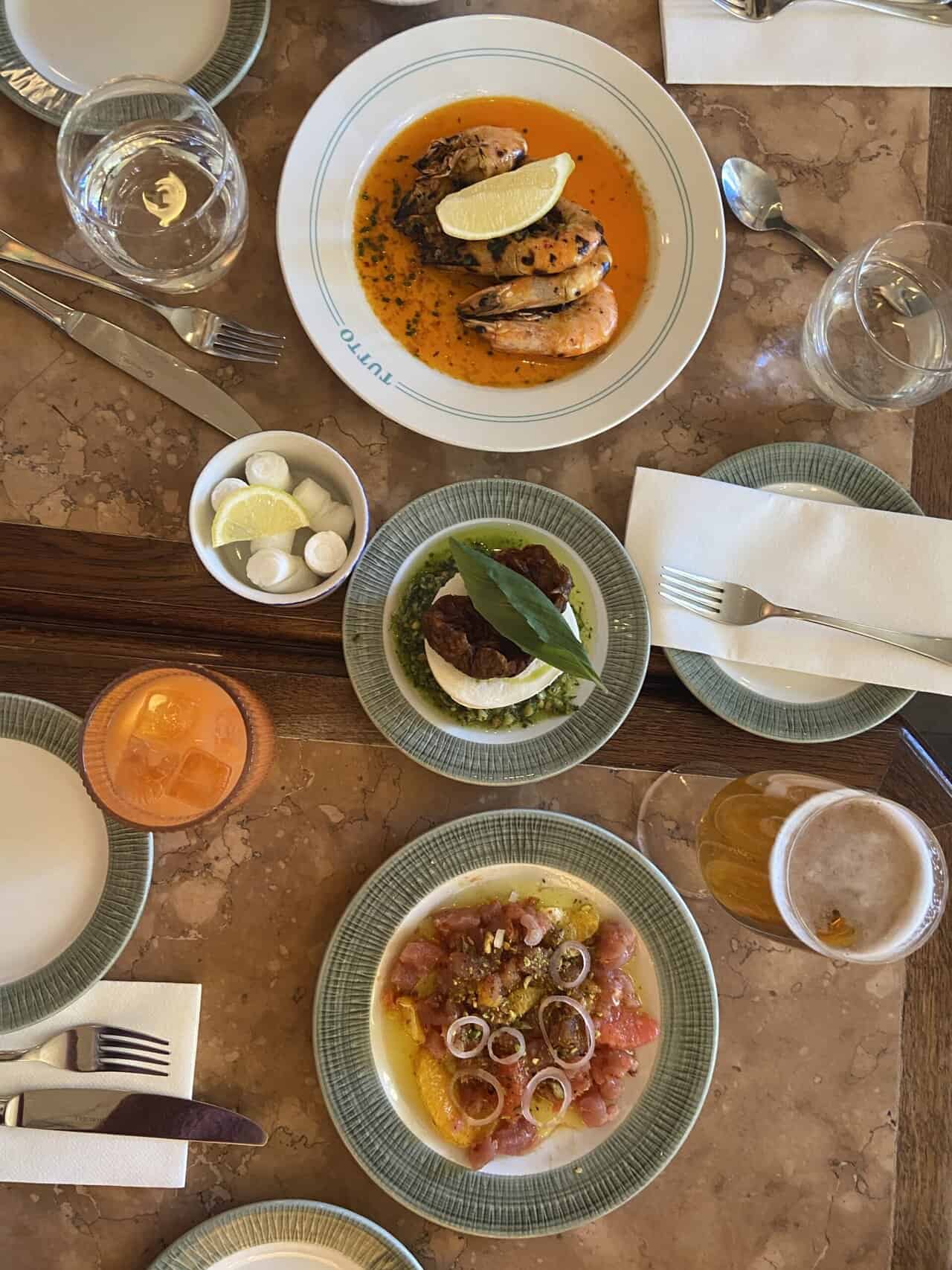 Your Guide to Brighton's North Laine 23 Table full of Italian food at Tutto Italian restaurant in Brighton
