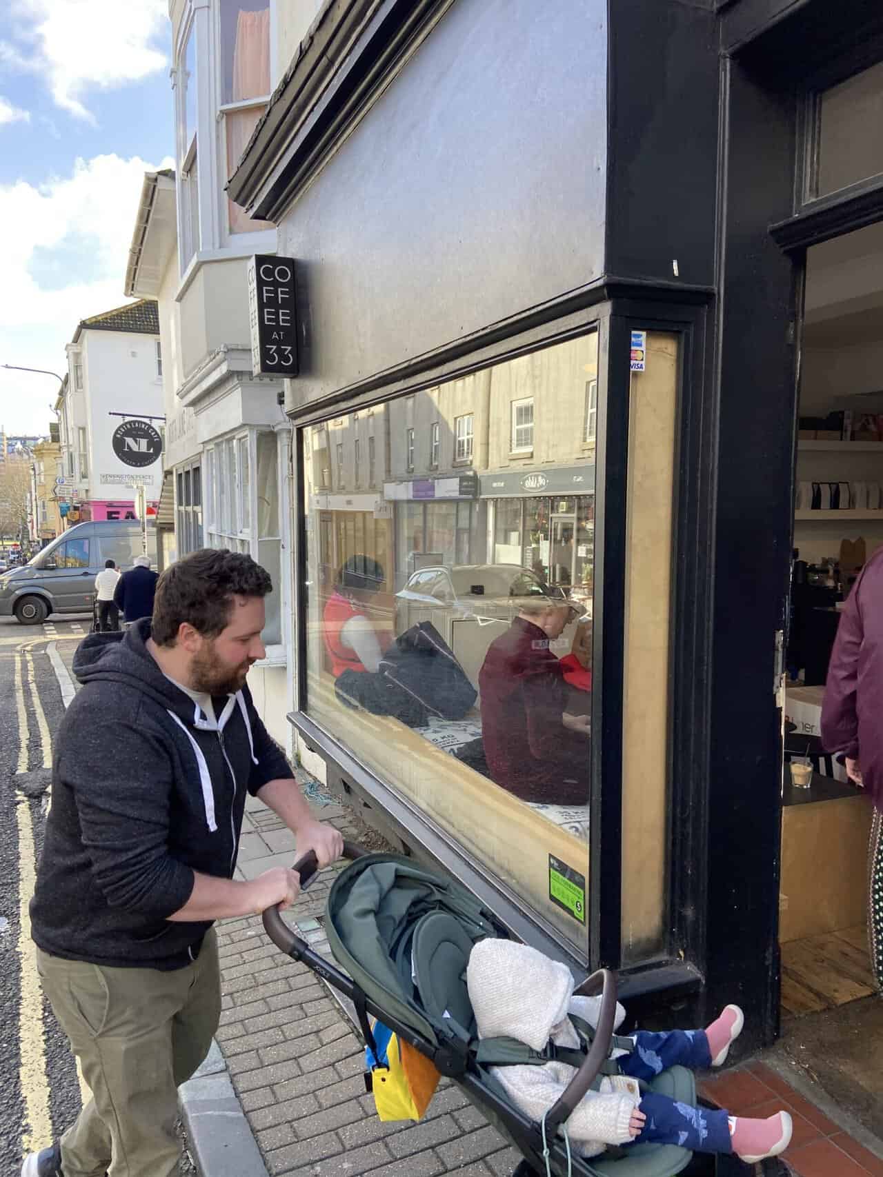 Your Guide to Brighton's North Laine 16 Colin pushing Baby C in her stroller into Coffee at 33 in the North Laine area of Brighton, England