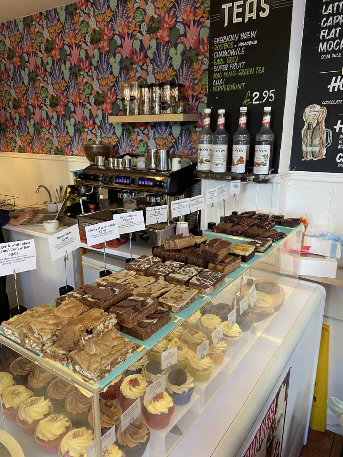 Your Guide to Brighton's North Laine 12 Inside Cloud9 in Brighton with a display case of brownies and cupcakes
