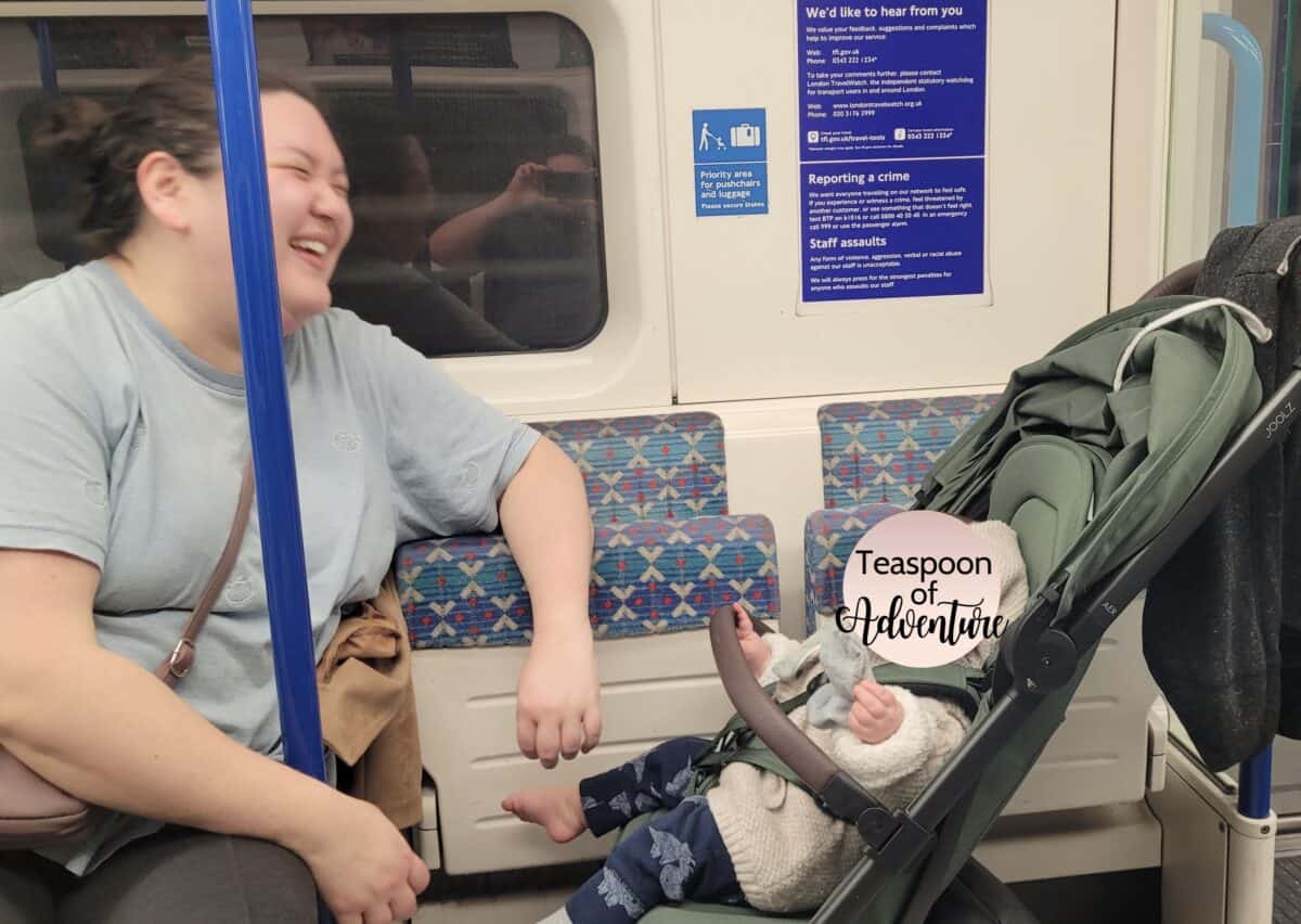 20+ Things to Do in London With a Baby 49 Riana and Baby C laughing on the London tube with Baby C in her stroller