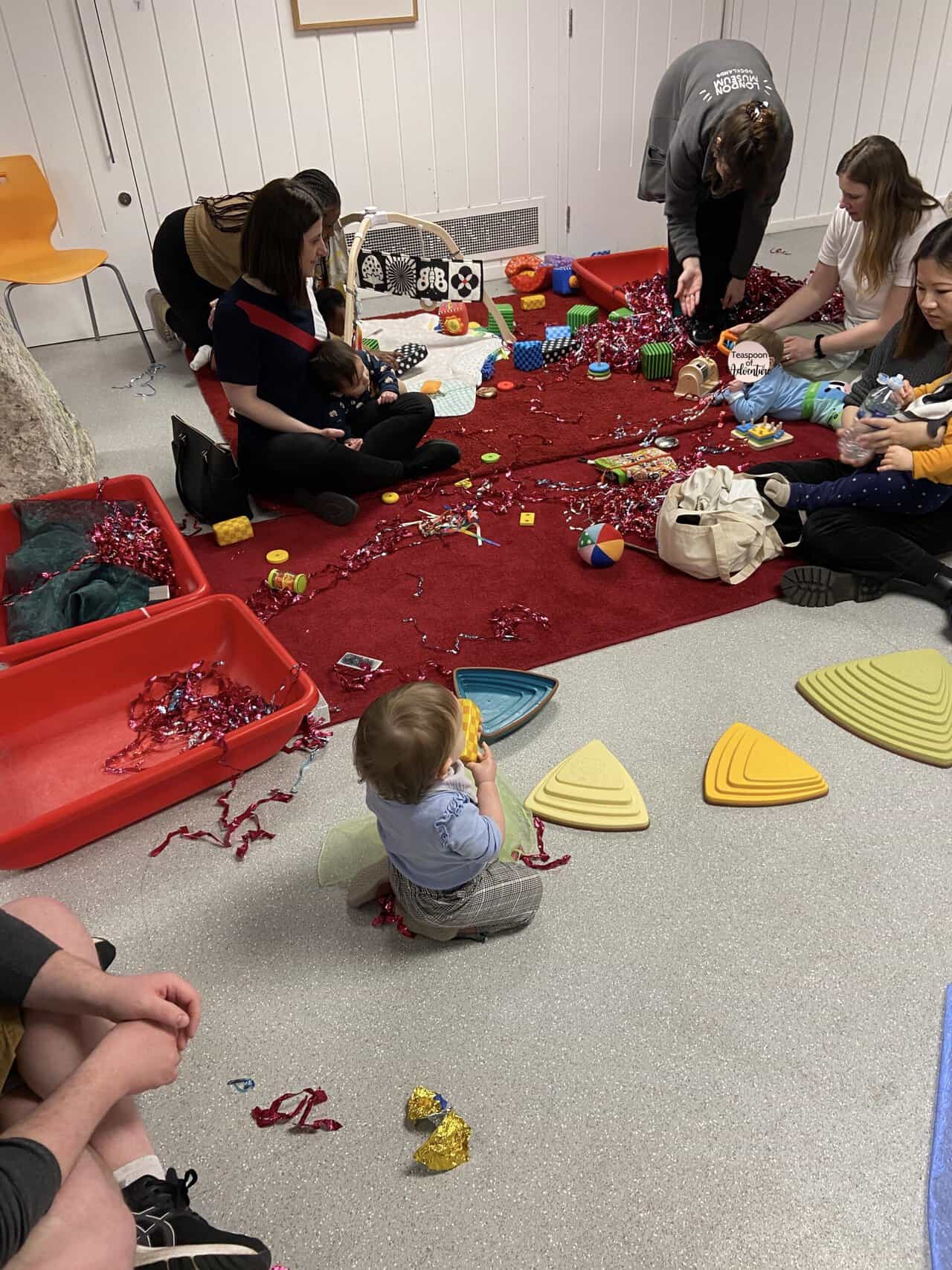 20+ Things to Do in London With a Baby 12 Baby C playing with toys, paper and other babies at Tots at the Docks drop in play session at London Museum Docklands