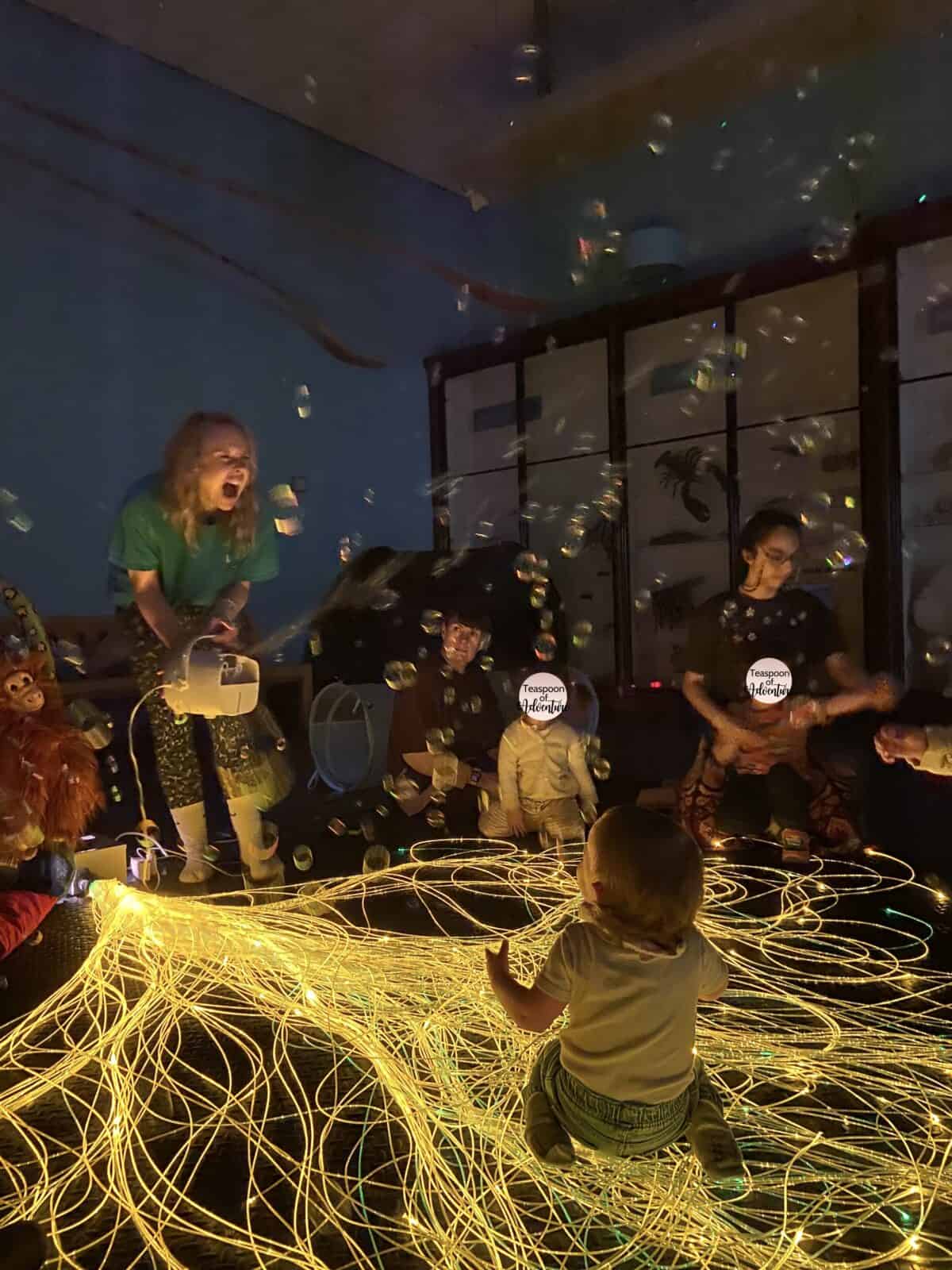 20+ Things to Do in London With a Baby 9 Adventure Babies session at the Natural History Museum in London with fibre optic lights and bubbles for the families
