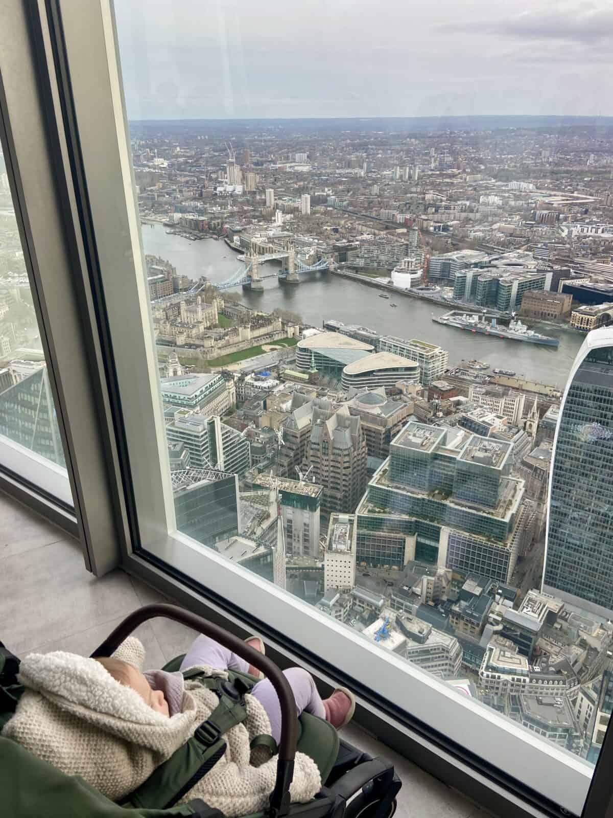 20+ Things to Do in London With a Baby 31 Baby C in her stroller looking at the view from Horizon 22, an observation deck in London, England