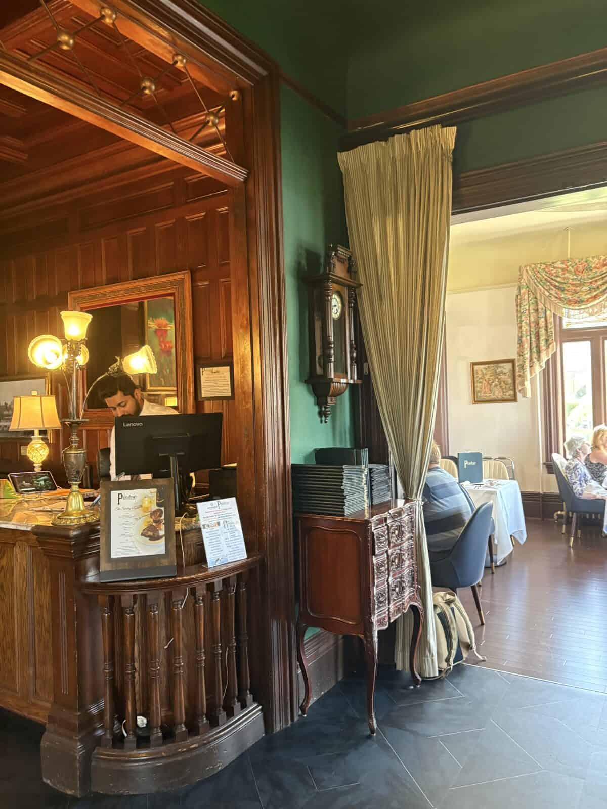 Pendray Tea House Review: Afternoon Tea in Victoria, BC 5 Entryway of Pendray Inn and Tea House in Victoria BC with wood panelling and looking into the dining room