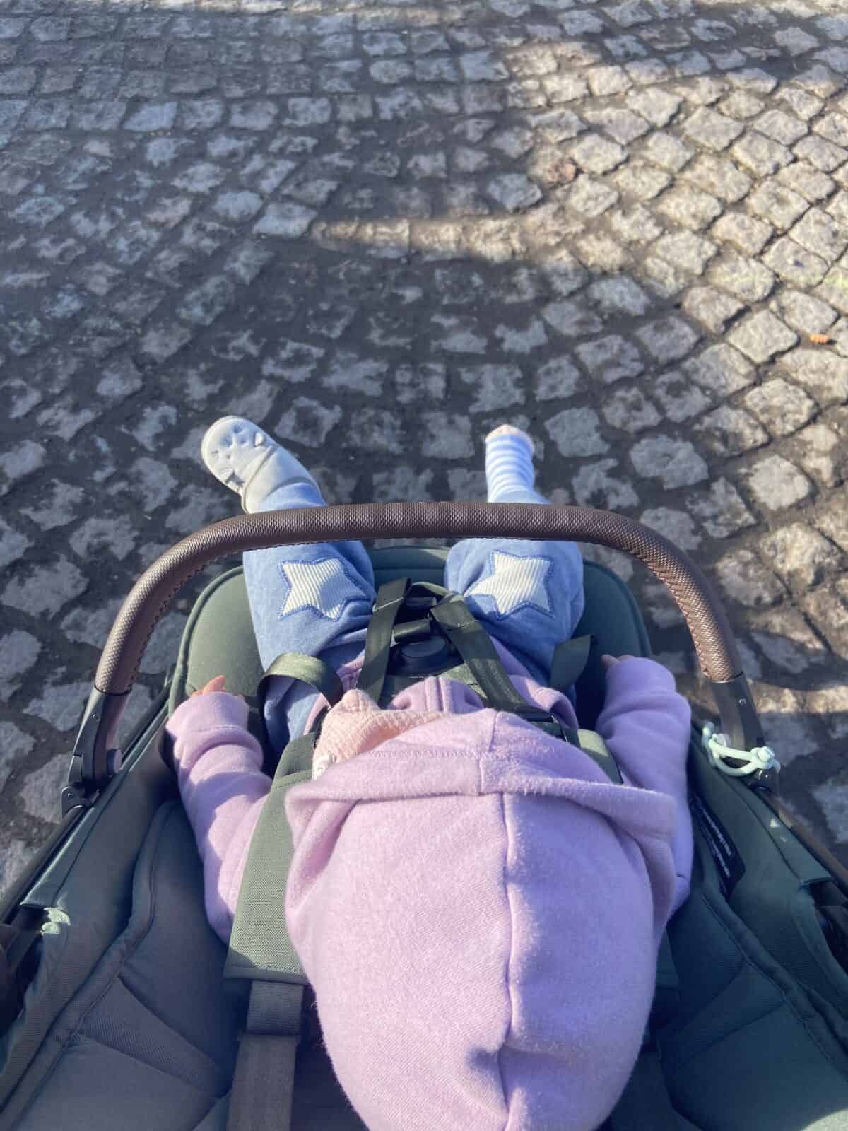 Joolz Aer Review: Is This the Best Travel Stroller? 9 Baby C in her Joolz Aer travel stroller with the bumper bar in front of her