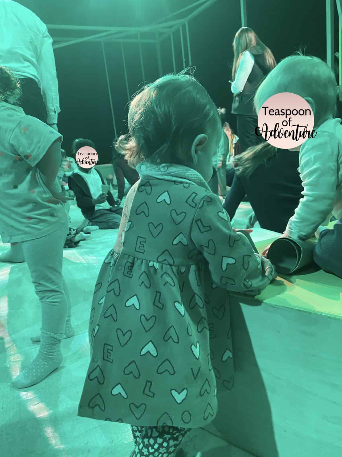 20+ Things to Do in London With a Baby 5 Baby C playing with stage props with other children at Unicorn Theatre's production of Squirrel in London