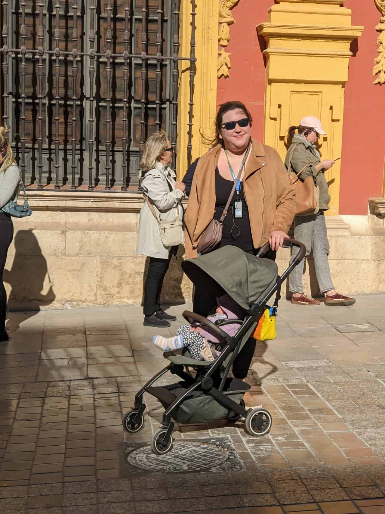 Joolz Aer Review: Is This the Best Travel Stroller? 22 Riana with Baby C in her Joolz Aer travel stroller on a walking tour in Malaga, Spain