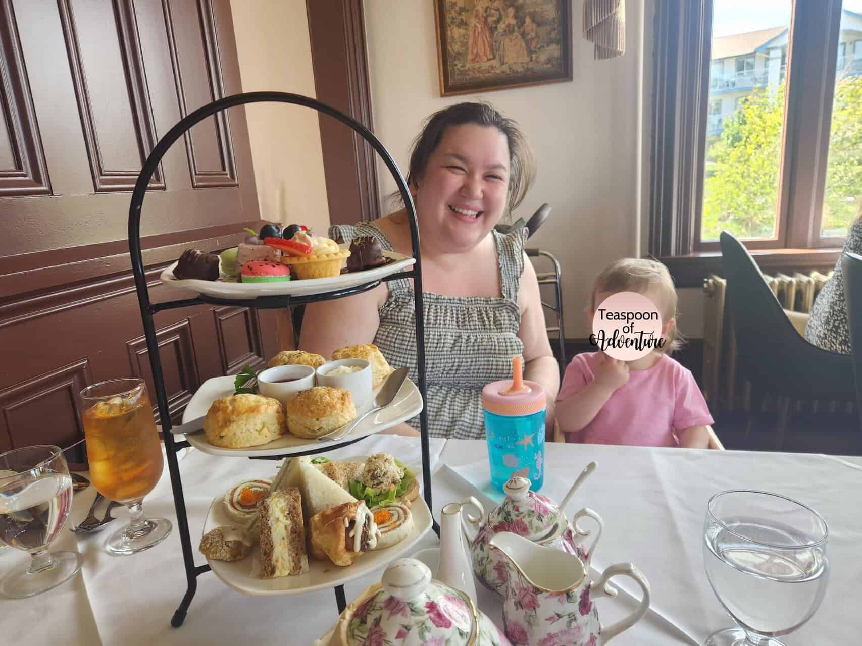 Pendray Tea House Review: Afternoon Tea in Victoria, BC 18 Riana and Baby C smiling behind the three tier stand at afternoon tea at Pendray Tea House, Victoria, BC
